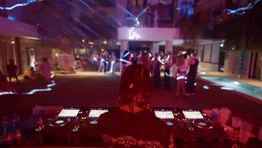 DJ booth, lighting and guests at a Bali villa event